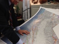John Parrish shows off a state map with 15,000 faults on it. He says there are likely many more faults that have not yet been discovered.