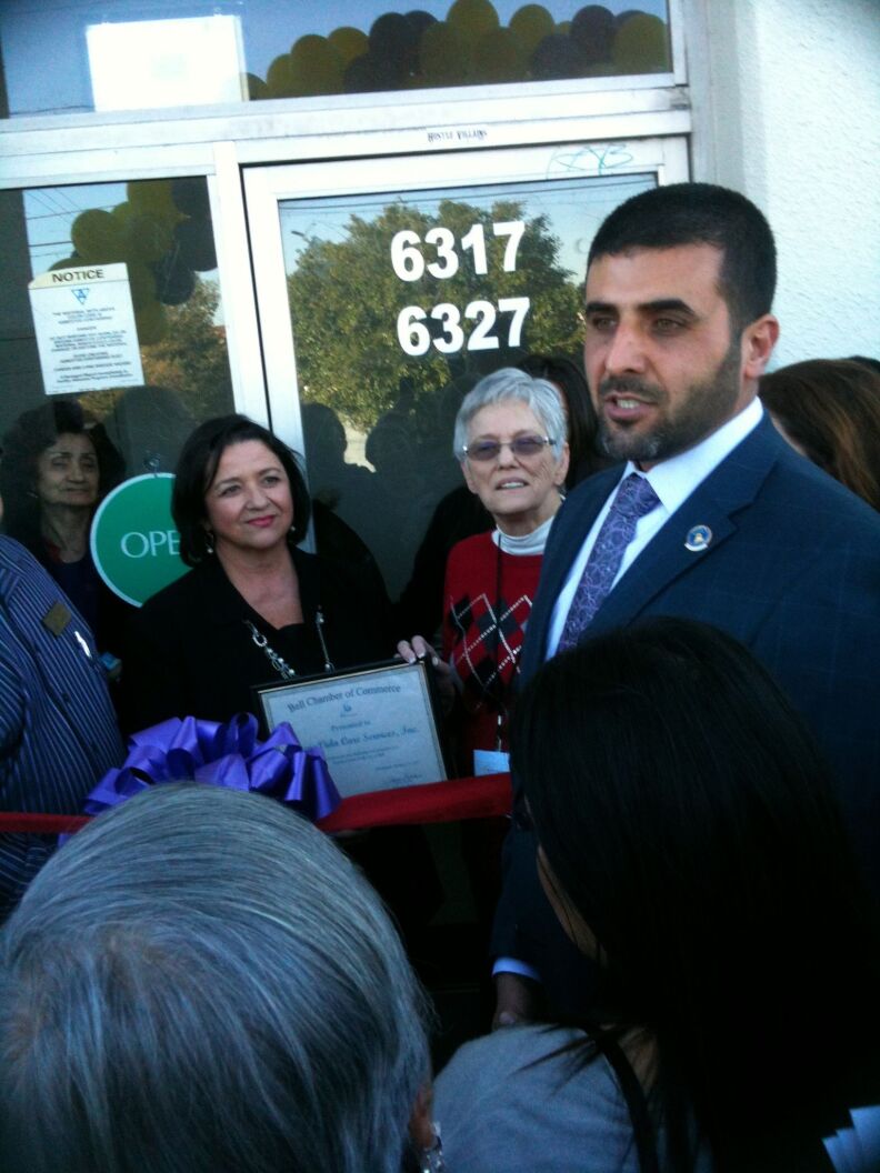 Bell Mayor Ali Saleh speaks to local business people at a ribbon-cutting ceremony Jan. 16, 2013.