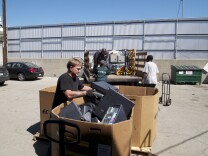 Unloading a truckload of e-waste at Isidore Recycling Company in Los Angeles.