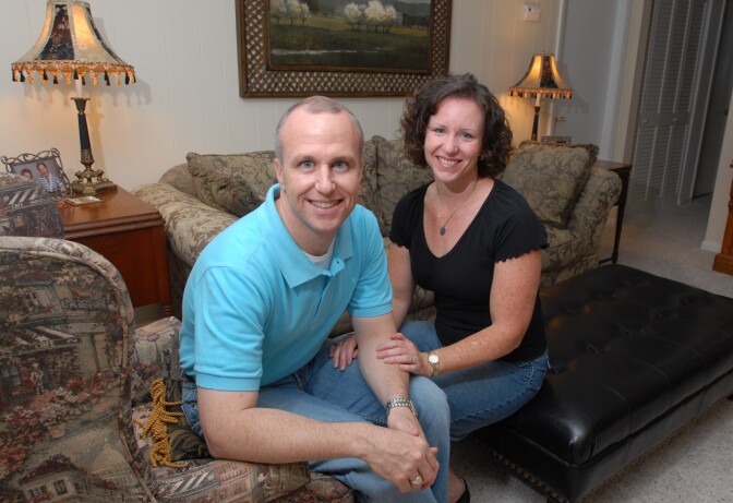 Alan Chambers, left, president of Exodus International, sits with his wife, Leslie, in their home in Winter Park, Fla. The president of the country's best-known Christian ministry dedicated to helping people repress same-sex attraction through prayer is trying to distance the group from the idea that gay people's sexual orientation can be permanently changed or "cured." Chambers said Tuesday, June 26, 2012 that their upcoming national conference would highlight his efforts to dissociate the group from the controversial practice usually called ex-gay, reparative or conversion therapy. 