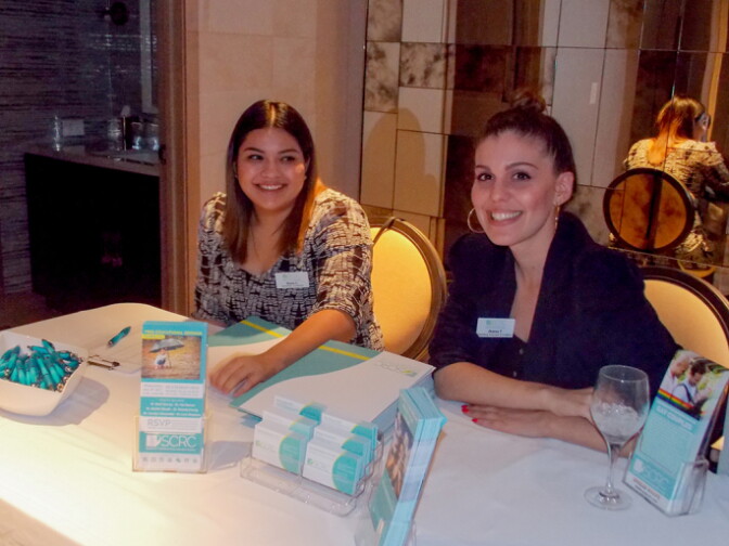 Two Southern California Reproductive Center employees register attendees at an “egg social” at the presidential suite of the Viceroy L’Ermitage in Beverly Hills.