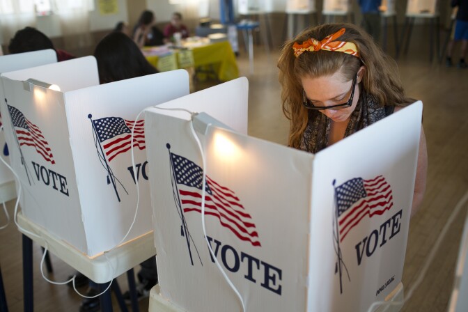 Los Angeles County residents vote inside All Saints Episcopal Church in Highland Park during election day on Tuesday afternoon, Nov. 4, 2014.