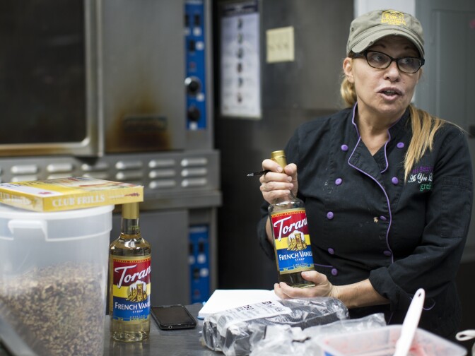 Grub co-owner Betty Fraser works with co-owner Denise DeCarlo on Wednesday, June 10, 2015 at their catering kitchen in Hollywood. Fraser and DeCarlo employ Sylvia and about three dozen others at their restaurant and catering service.