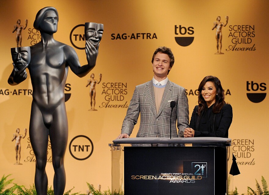 WEST HOLLYWOOD, CA - DECEMBER 10:  Actors Ansel Elgort and Eva Longoria speak onstage during TNT's 21st Annual Screen Actors Guild Awards Nominees Announcement And Holiday Auction Display at the SilverScreen Theater at the Pacific Design Center on December 10, 2014 in West Hollywood, California.  (Photo by Gregg DeGuire/WireImage)
