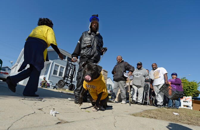 File: People line up to receive Thanksgiving meals during Jackson Limousine's 30th annual turkey giveaway on Nov. 20, 2012 in Los Angeles.