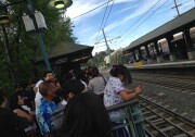 Riders stranded at the South Pasadena Metro station due to a sagging power line on Wednesday, April 9, 2014.