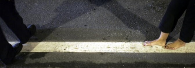 Officer Kevin Millan from the City of Miami Beach police department instructs a woman how to walk the white line during a field sobriety test at a DUI checkpoint December 15, 2006 in Miami, Florida. According to police, the woman failed a breathalyzer test by blowing into the device and receiving two readings one at .190 the other .183, which is twice the legal limit in Florida. The city of Miami, with the help of other police departments, will be conducting saturation patrols and setting up checkpoints during the holiday period looking to apprehend drivers for impaired driving and other traffic violations.