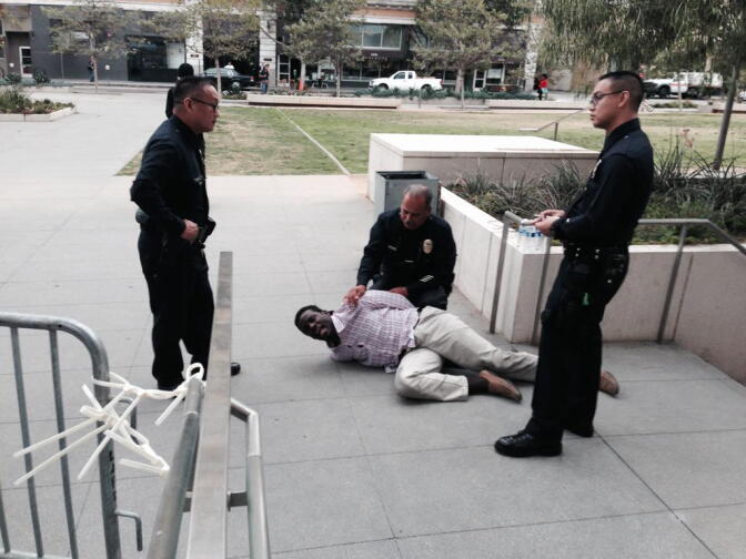 Protester Evan Bunch was dragged out of the Los Angeles Police headquarters during a police commissioner meeting on the shooting death of Ezell Ford on Tuesday, June 5, 2015.