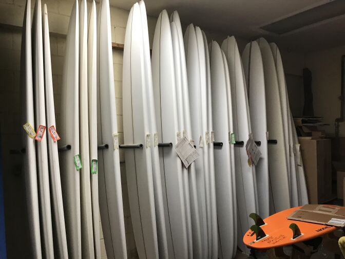 Harbour's workshop has dozens of surfboards in various states of completion.