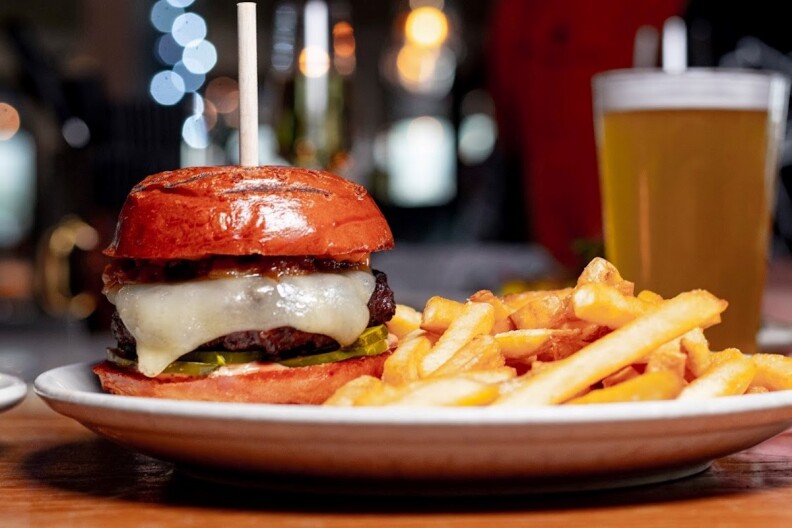 Mess Burger with a side of fries and a beer.