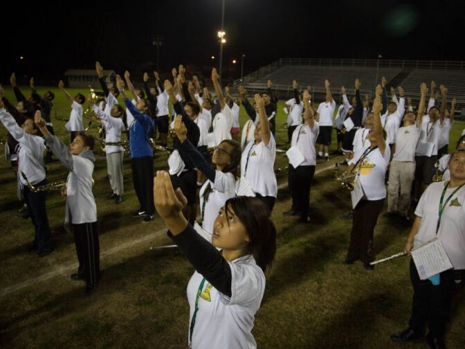 Carole Tu-Do practices dance maneuvers included in the groups show during a rehearsal at South Hills High School.