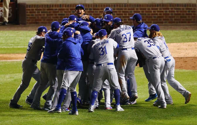 CHICAGO, IL - OCTOBER 19:  The Los Angeles Dodgers celebrate defeating the Chicago Cubs 11-1 in game five of the National League Championship Series at Wrigley Field on October 19, 2017 in Chicago, Illinois. The Dodgers advance to the 2017 World Series.  (Photo by Stacy Revere/Getty Images)