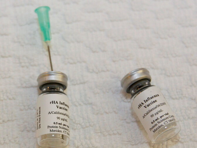 Bottles of swine flu vaccine at the Flinders Medical Center in Adelaide, Australia, in July. Australia is conducting the world's first human trials of a swine flu vaccine.