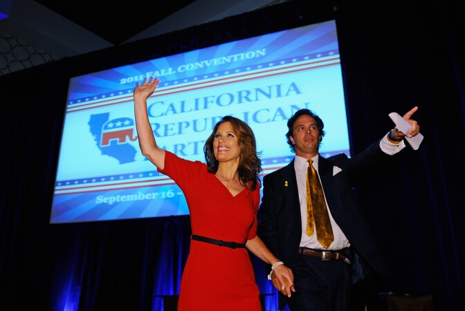 LOS ANGELES, CA - SEPTEMBER 16: Republican presidential candidate Michele Bachmann (R-MN), escorted by California Republican Party chairman Tom Del Beccaro, arrives to deliver a speech to the California Republican Party Convention banquet September 16, 2011 in Los Angeles, California. The three-day California Republican Party 2011 Fall Convention and the straw poll started today in downtown Los Angeles.  (Photo by Kevork Djansezian/Getty Images)