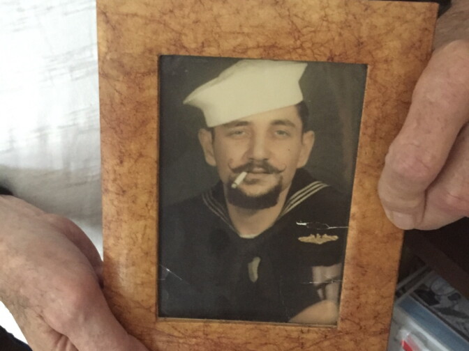 A photo of a goateed Dick Oliver, taken after returning from a submarine combat patrol off North Korea.