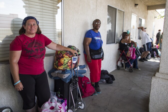 Victoria Burton waits in line to get a bed for the night at Grace Resource Center's Lancaster Community Homeless Shelter on Tuesday afternoon, May 31, 2016. Burton, a U.S. Navy veteran, is originally from Australia. She has been homeless once before, for more than a year in Oklahoma.