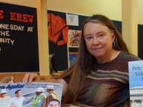 Jill Vassilakos-Long of San Bernardino shows some of the many mailers sent to her home during the primary election in the 31st Congressional District.