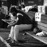 LOS ANGELES, CALIFORNIA - OCTOBER 09: (EDITOR'S NOTE: This iage has been converted to black and white) Clayton Kershaw #22 of the Los Angeles Dodgers sits in the dug out after leaving the game and giving up back to back home runs in the eighth inning during game five of the National League Division Series against the Washington Nationals at Dodger Stadium on October 09, 2019 in Los Angeles, California. (Photo by Harry How/Getty Images)