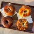 Four Taiwanese-style bagels arranged on a wooden tray at Miopane in Pasadena.