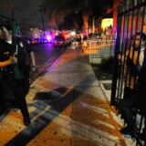 Los Angeles Police officers speak to protestors demonstrating against the Police shooting of Guatemalan immigrant Manuel Jamines on September 8, 2010 in Los Angeles, California.
