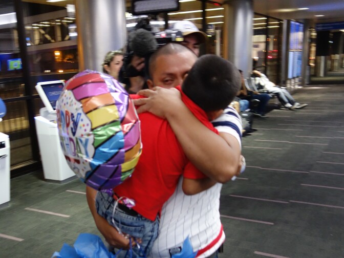                                Unauthorized Guatemalan immigrant Hermelindo Che Coc hugs his son Jefferson, 6, after the pair were reunited at LAX after a 48-day separation forced by a change in federal immigration policy.