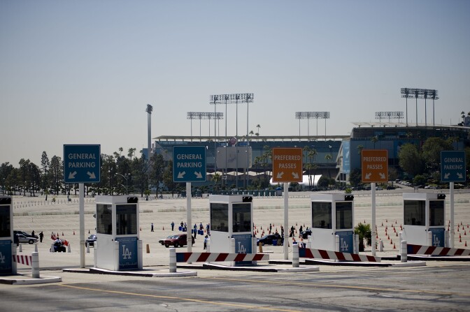 LOS ANGELES - JULY 6:  People wait on line  at the Michael Jackson Memorial Service ticket pick-up area held at a parking lot at Dodger Stadium July 6, 2009 in Los Angeles, California. The Jackson memorial service is to be held at the Staples Center on Tuesday, July 7. Jackson died at the age of 50 at the UCLA Medical Center after going into cardiac arrest on June 25 in Los Angeles, California. (Photo by Michal Czerwonka/Getty Images)