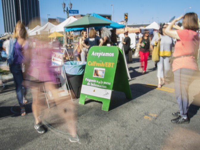 A sign at the Hollywood Farmers Market tells shoppers EBT is accepted. 
