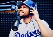 Person wears a baseball cap and a jersey that says "Dodgers."