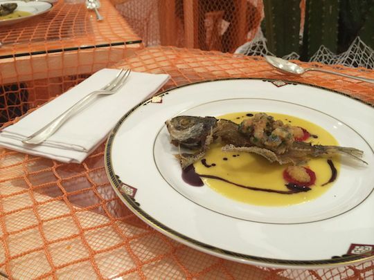 The second course, served in the Dining Room, is fried and raw pompano carcass. It's dressed with corn juice, black olive oil, roe and fresno chili.