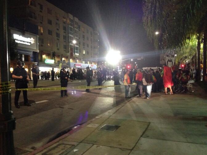 Police monitor protestors outside the new Walmart in Chinatown on Thursday, Nov. 7, 2013.