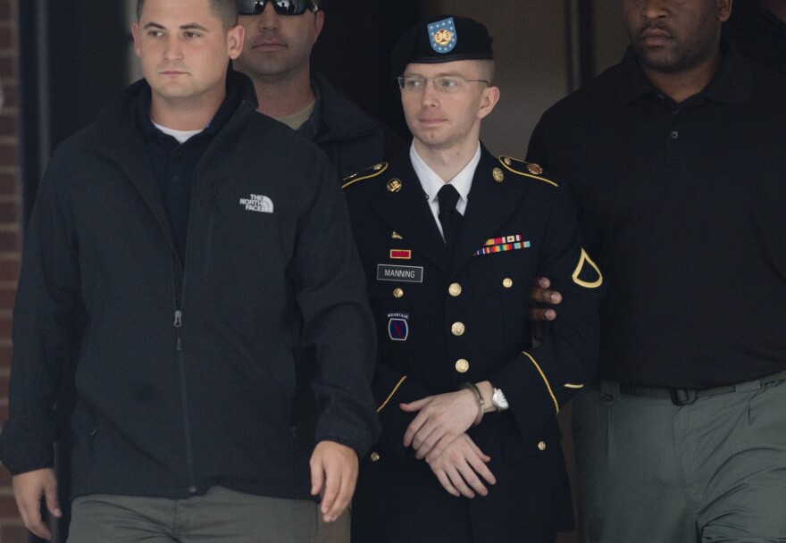 US Army Private First Class Bradley Manning departs a US military court facility at Fort Meade, Maryland on August 20, 2013.