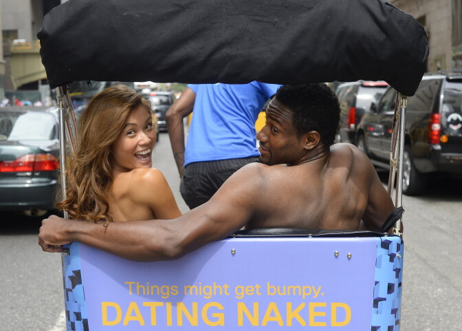 Kelly Keodara and Yarc Lewinson ride around Grand Central Station in New York on July 16, 2014 in a pedicab to promote a new VH1 series to the roster called 'Dating Naked,' which is built on the premise of stripping away the outer trappings of attraction by dating naked. 