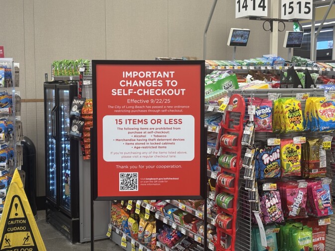 A sign in a supermarket stating "Important changes to self-checkout" followed by a list of rules.