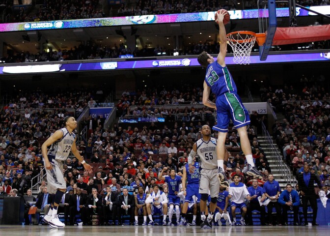 Eddie Murray #23 of the Florida Gulf Coast Eagles dunks in the second half against Jabril Trawick #55 of the Georgetown Hoyas during the second round of the 2013 NCAA Men's Basketball Tournament at Wells Fargo Center on March 22, 2013 in Philadelphia, Pennsylvania.  