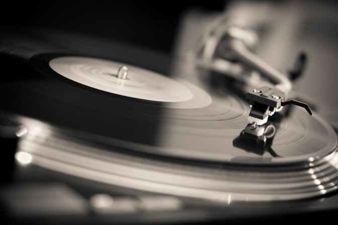 A turntable plays an LP record.