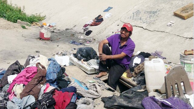 Abimael Martinez lives in a hole he dug in the Tijuana River channel, a short walk from the U.S.-Mexico border.
