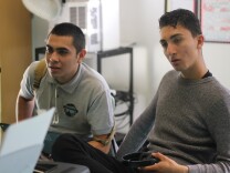 Students work with composer Mina Bloom to "set" their lyrics with music. 