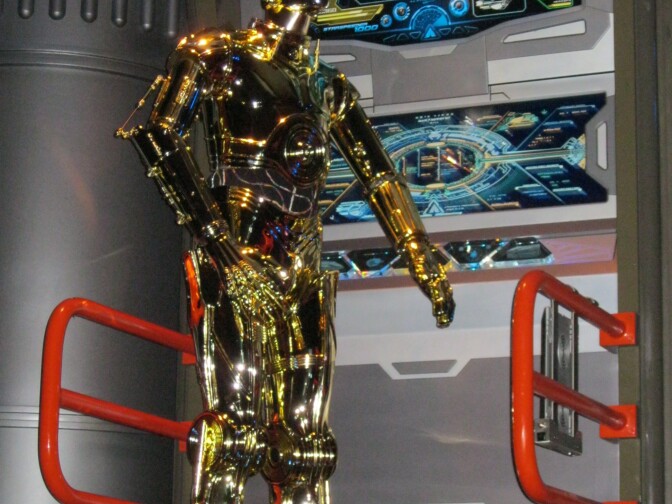 Guests in line at Star Tours can rub elbows with some classic characters from the "Star Wars" movies, including C-3PO, a main character in the ride.