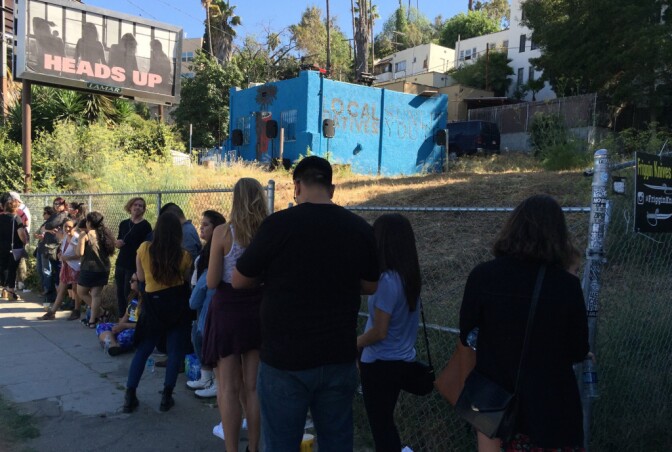 Local Natives getting ready to perform on top of its practice space in Silver Lake.