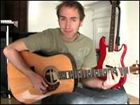 What's That Chord? Justin Sandercoe plays a B minor bar chord in a video teaching how to play the Coldplay song "Trouble."