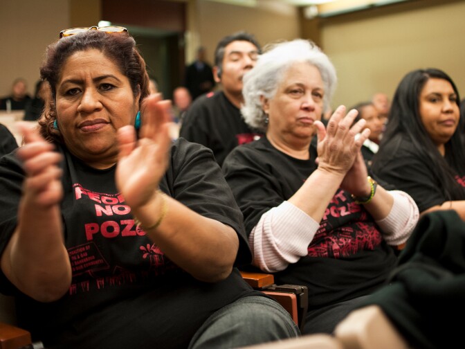 Members of the Esperanza Community Housing Corporation attend a town hall meeting discussing recent findings from air monitoring and enforcement efforts related to AllenCo Energy, Inc. in the University Park. The meeting was hosted by the South Coast Air Quality Management District on Wednesday at Mount St. Mary's College.