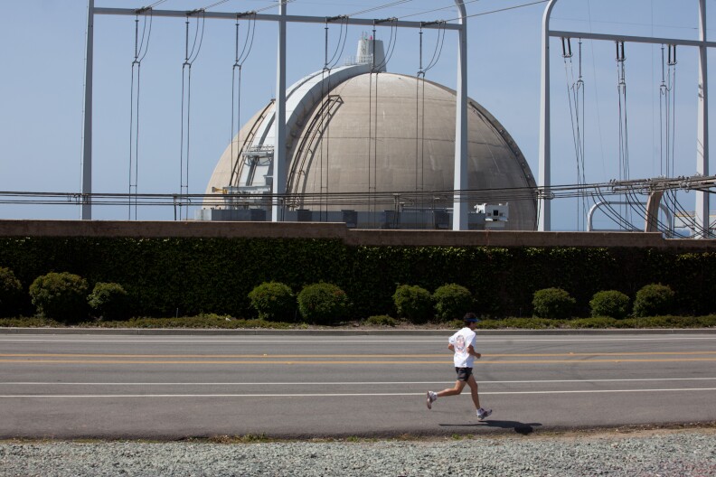 A runner passes by the San Onofre Nuclear Power Plant on April 6, 2012.
