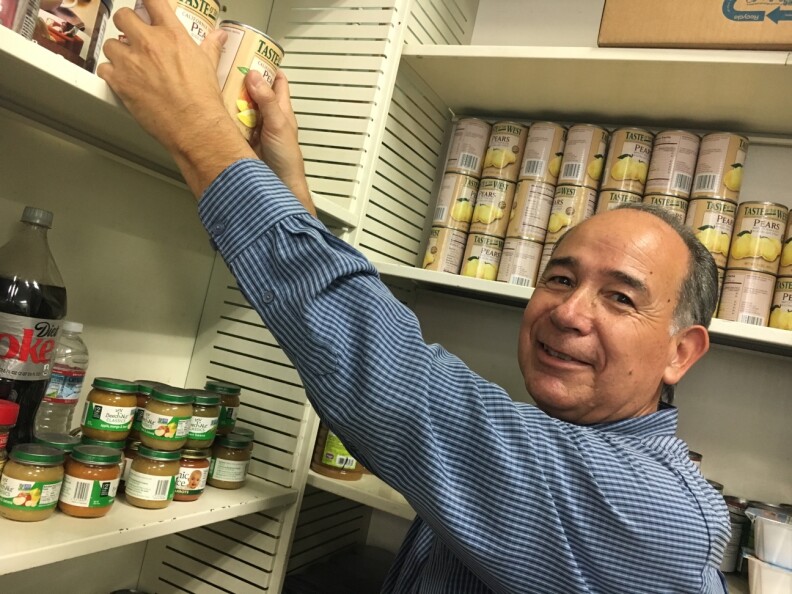 Andy Molina runs a food pantry at the Southeast Churches Service Center in Huntington Park. He said he's seen a rise in homeless in the area, including military veterans, who come daily to his pantry seeking help.