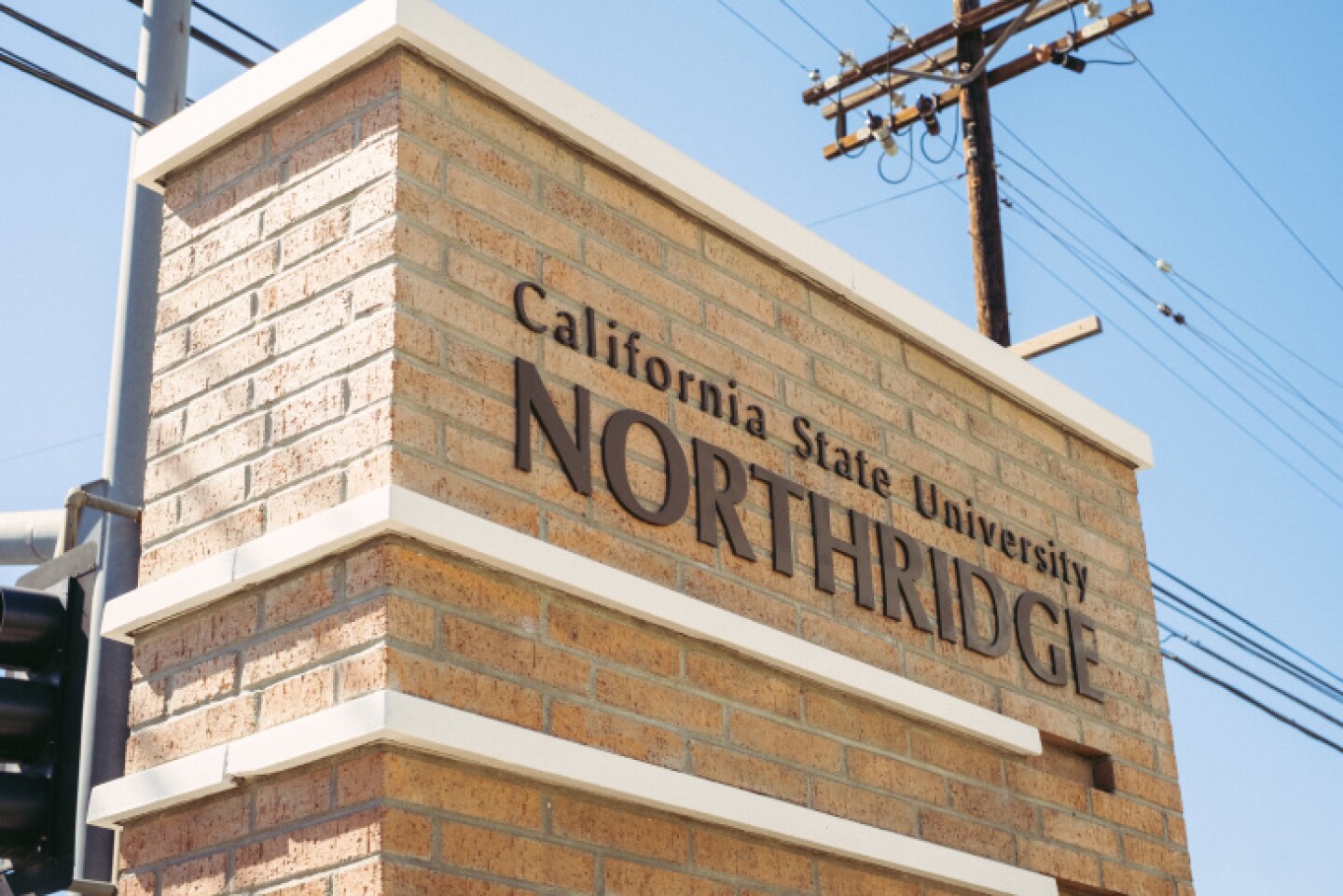 A sign posted outside California State University, Northridge that reads, California State University, Northridge.