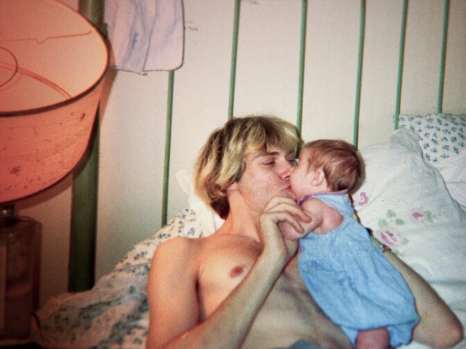 An archival photo of Kurt Cobain with daughter Frances.