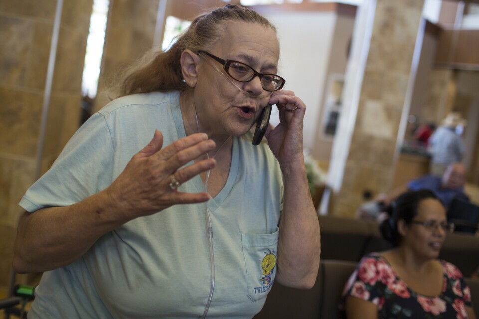 Doris Dodee anxiously awaits to be reunited with her 82-year-old husband, Glen Huffman, at a Red Cross evacuation center at the Jessie Turner Community Center on Wednesday afternoon, Aug. 17, 2016. Her husband flagged down a sheriff to help him get out of the area.
