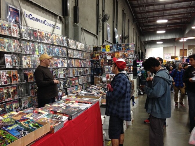 Comics fans check out the deals and special finds at Jay Company Comics, a booth at Frank & Son.