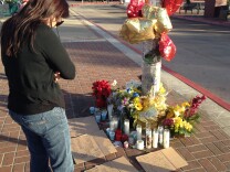 Libby Post stands at a makeshift memorial for Kelly Thomas Tuesday morning. 