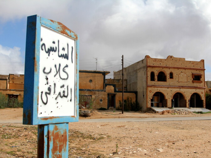 A sign in the abandoned village near Zintan reads, "Mushashya: Gadhafi dogs." 