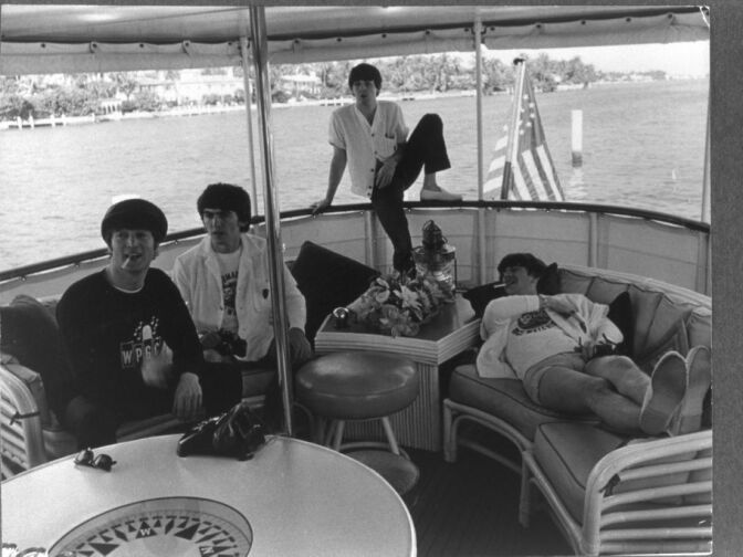 British rock group The Beatles relax on a boat off the coast of Miami, Florida, February 1964. L-R: John Lennon, George Harrison, Paul McCartney and Ringo Starr.